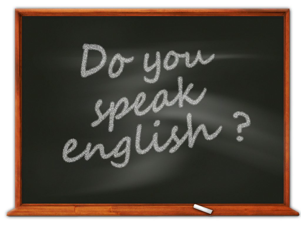 Bild på en griffeltavla med texten "do you speak english?"